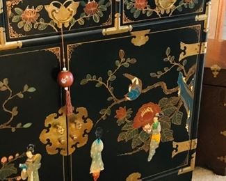 Oriental cabinet with relief