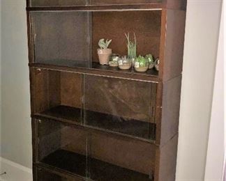midcentury bookcase with sliding glass doors