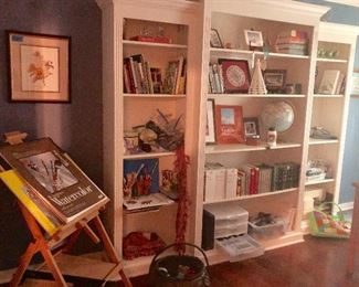 Art room filled with supplies including watercolor, acrylics, yarn, crochet and knitting 