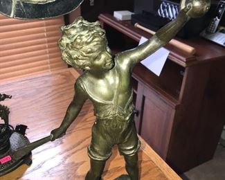 BRONZE SCULPTURE OF A BOY PLAYING A BALL GAME - CIRCA 1900. SIGNED