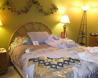 Rattan headboard, floral swag, light fixtures