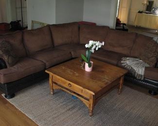 Walter E. Smithe sectional sofa with leather, brass nail head structure.  Vintage coffee table.