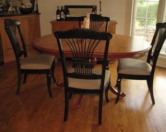 Dining table with black, spindled chairs