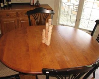 Dining table with black, spindled chairs