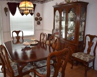 Beautiful Dining Room Set featuring Dining Table with 8 matching Chairs, matching China Cabinet and custom Pads for the Table Top