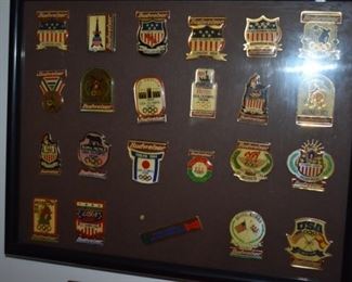 Plaque displaying many of the USA Olympic Pins from over the years