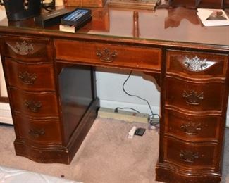 Beautiful Knee Hole Desk with Nicely Carved Handles on top Drawers and Serpentine Drawers down the sides.