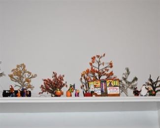 Department 56 Christmas and Halloween Village Pieces displayed on Shelving Unit running around the Living Room. Beautiful Lighted Display! All will sell separately or perhaps you would prefer to purchase the entire set!?!