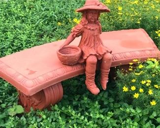 Garden bench with girl statue