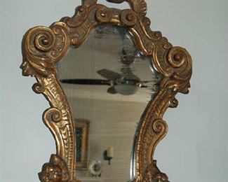 One of pair of gold mirrors