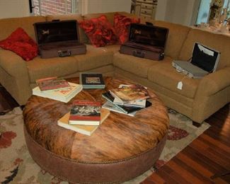 Round rawhide coffee table and sectional sofa