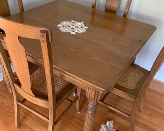 Antique Oak table and chairs with 3 additional leaves. Great condition.