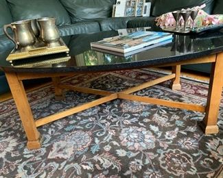 Coffee table with solid granite top. 