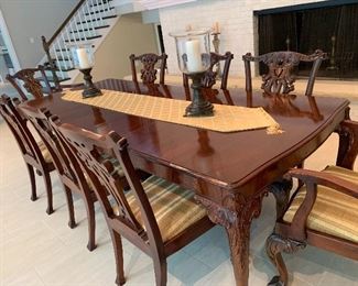 Exceptional dining room set with solid wood carved chairs from England.