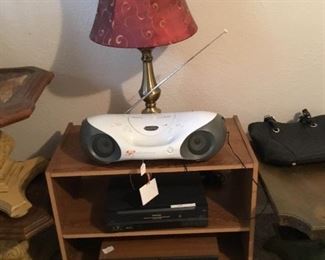 Portable am/fm cd player, rolling table, vhs player, lamp