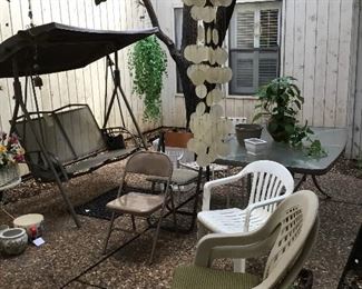 Patio chairs, tables, covered swing