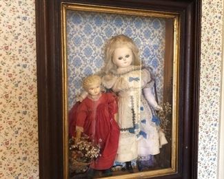 Antique dolls in shadow box showcase...