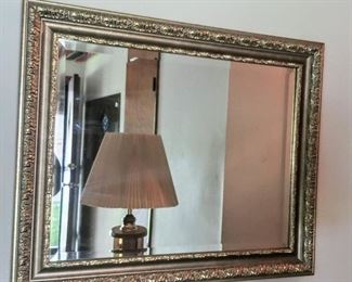 large gold framed mirror