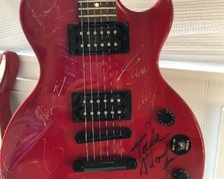 Autographed guitar by Eddie Money