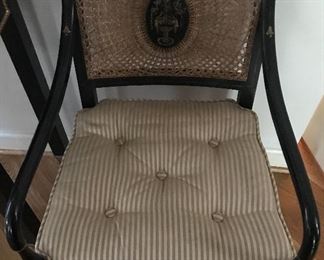 One of a pair of antique caned chairs