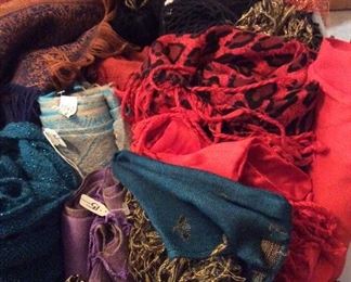 lots of scarves, shawls, and accessories