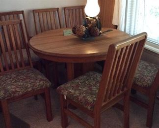 dark oak round table with 6 chairs and one leaf, sturdy and in great shape, priced to sell