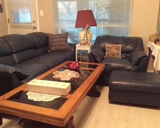 Blue leather couch and matching chair with ottoman