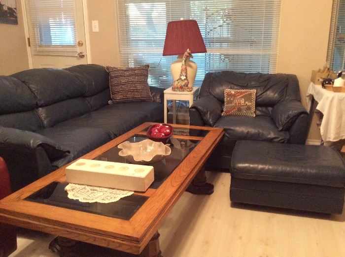 Blue leather couch and matching chair with ottoman