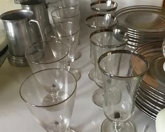 Mid century glasses with chrome silver rims. Matching appetizer plates