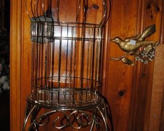 Brass birdcage and and brass and glass tables