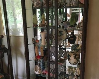 Beautiful lighted curio cabinet filled with treasures