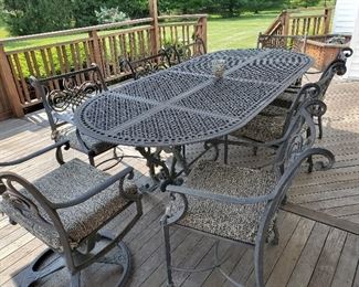 Patio World Classic Cristo Cast Aluminum Table with 2 Swival Rockers & 4 Arm Chairs 96" L x 41" W x 30" T