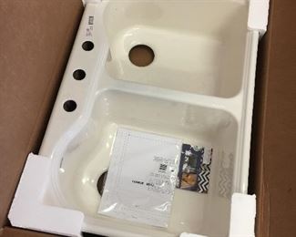 A NEW IN BOX Koehler kitchen sink #5818-4-96. See box number in the next pic, and the following pic you can see the exact sink as it is installed in the house.