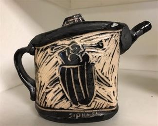 Local artist Dennis Sipiorski (teaches at SLU) teapot.  There are also cups