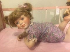 Beautiful Baby Doll, Porcelain with pink baby bed, others dolls and wood cradles too