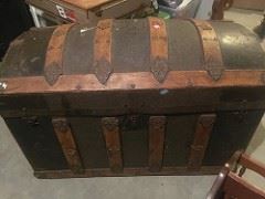 Old trunk with leather and metal patina embossments