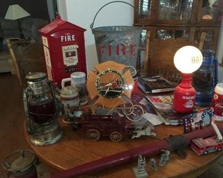 Fire call box with phone, OLD fire bucket, Cast Iron horse drawn hose wagon, Beer Steins, Vintage Fire Magazines. Vintage Clock