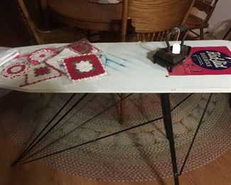 Advertising ironing board with a few linens