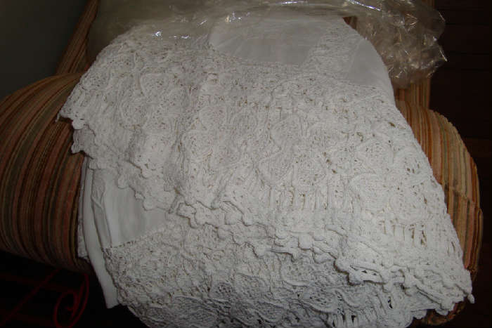 Lots of antique handmade lace tablecloths, linens, most from France