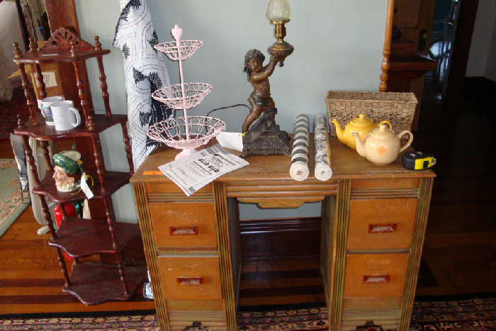 Small vintage child's distressed desk.  Cherub antique lamp.