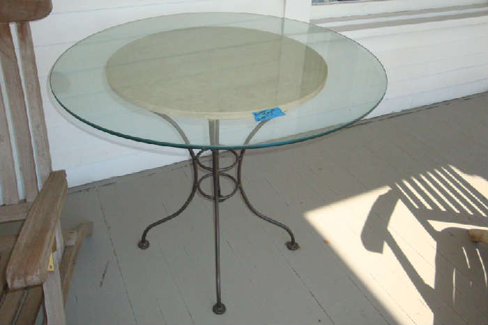 Glass and iron patio table