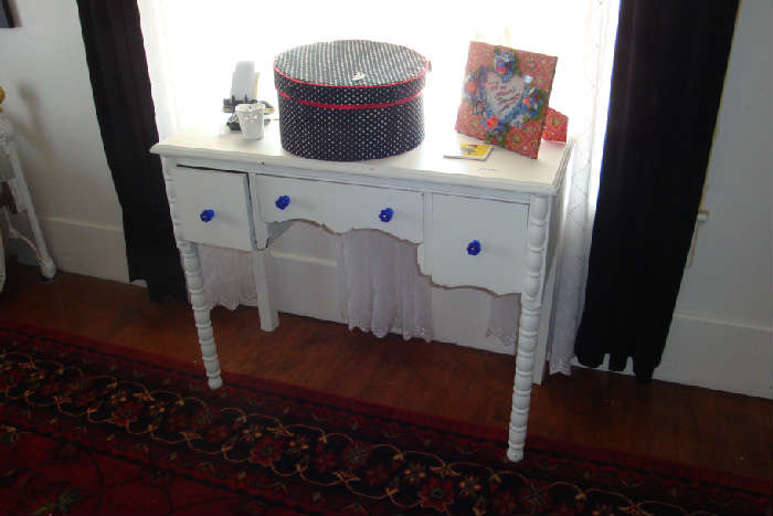 Little white distressed desk with blue glass knobs