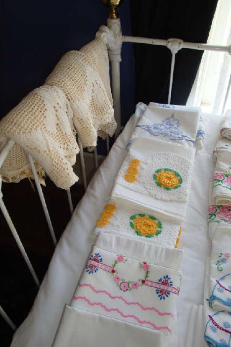 Lots of hand embroidered or crocheted standard or queen pillowcases and French linens, handmade