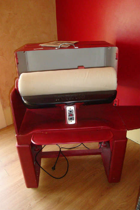 Ironrite Ironer. From the 1950's.  Still works great. Sit down for a fun afternoon ironing those sheets and tablecloths.  It actually IS fun!
