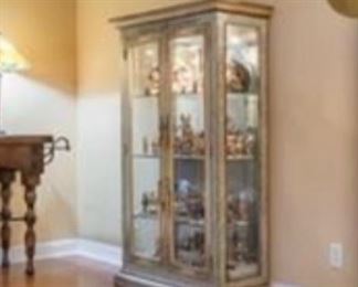curio cabinet filled with Hummels