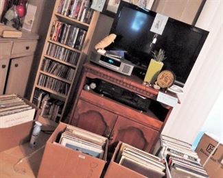 Flat screen TVs.  CDs and DVDs, 100s and 100s of Vinyl record albums.