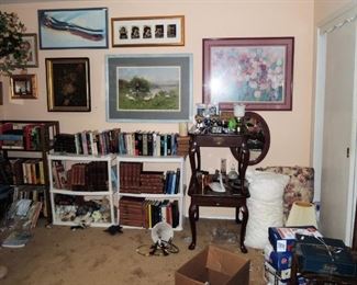 Books.  Large framed art. End tables, single chairs