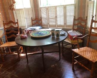 dinette table and 4 chairs that will never fit around it I think