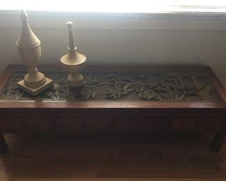 This is a carved teak table from the Queen Mary.