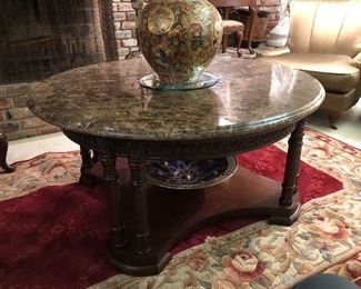  Jensen style marble top centerpiece table. 46” round cocoa marble over eight pillar legs with carved apron. Handmade wool rug.  8.2x5.2